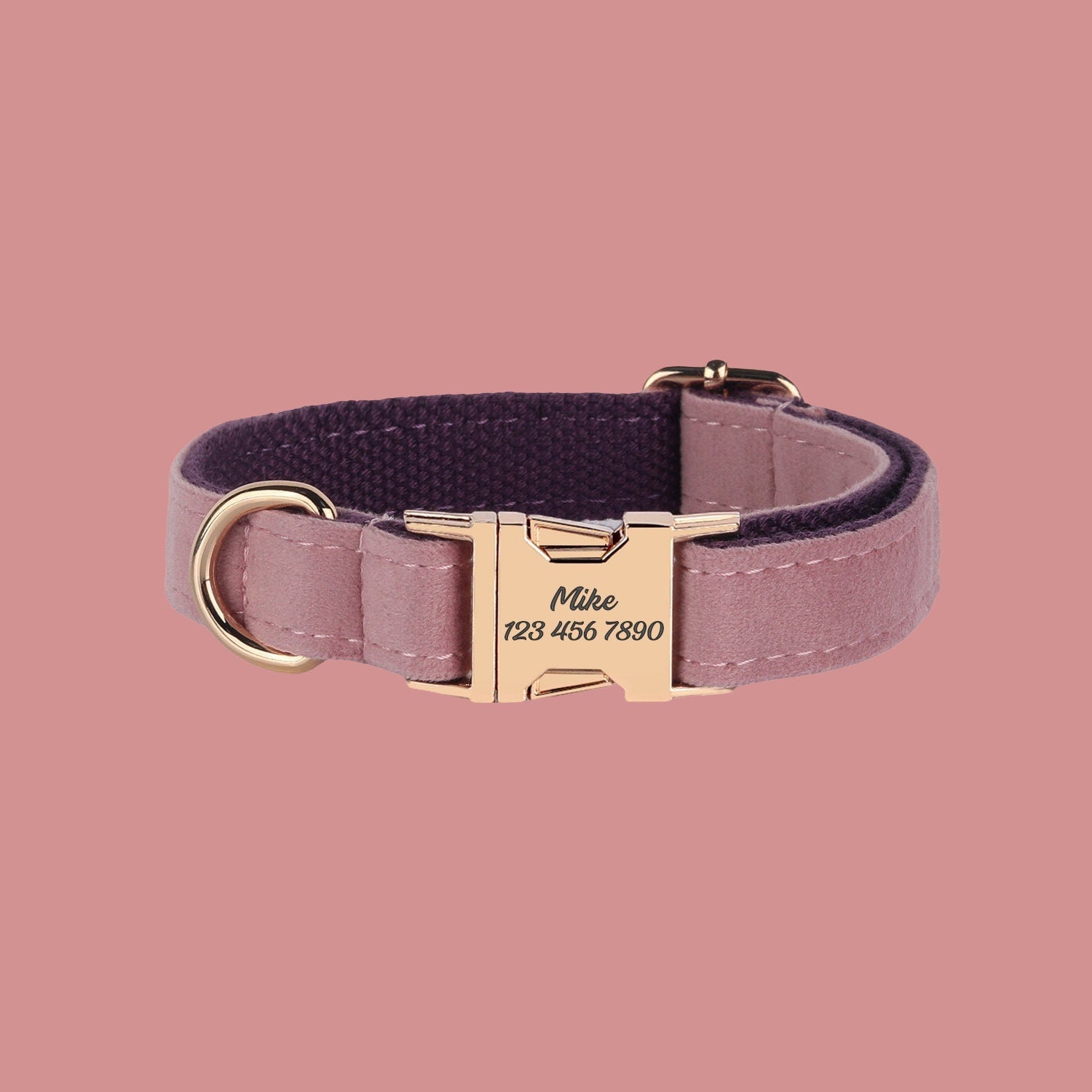 a pink collar with a gold buckle on a pink background
